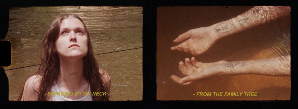Preacher's Daughter era, Family Tree film still, in the river looking skyward, and tattooed arms under the water